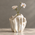 MARVOLM molten lava ruffle-rim sculptural vase clean product shot — organic flowing ridges, irregular ruffle top edge, iridescent champagne pearl glaze, neutral background