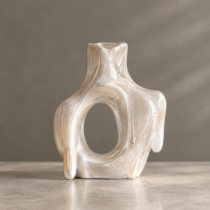 MARVOLM lava-flow open-oval sculptural vase clean product shot — large oval window, flowing lava arms, narrow neck opening, iridescent champagne pearl glaze, neutral background